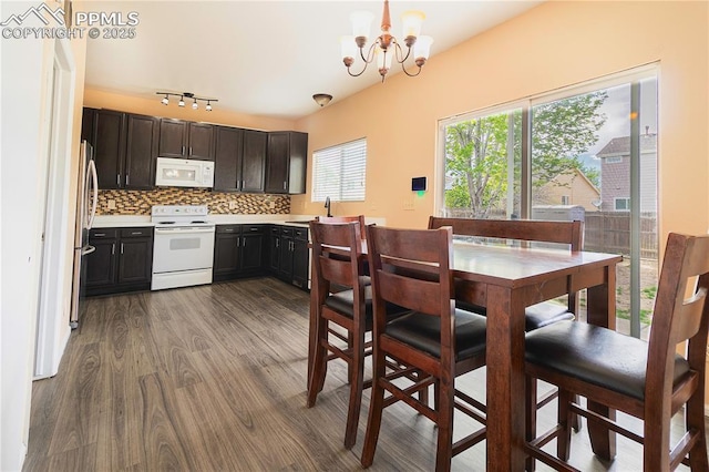 3808 Happy Jack Dr, Colorado Springs, CO 80922 - dining area with a chandelier and wood finished floors