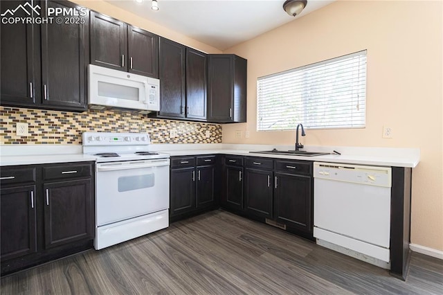 3808 Happy Jack Dr, Colorado Springs, CO 80922 - kitchen with white appliances, a sink, dark wood-style flooring, and decorative backsplash