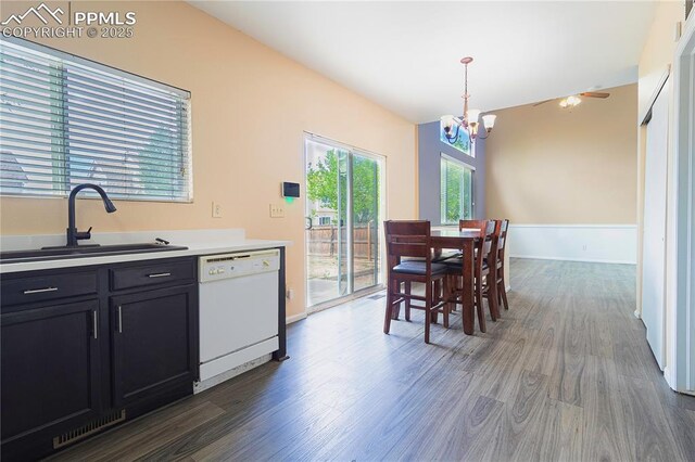 3808 Happy Jack Dr, Colorado Springs, CO 80922 - kitchen with white dishwasher, a sink, a chandelier, dark cabinets, and dark wood-type flooring