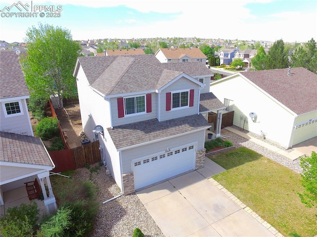 3808 Happy Jack Dr, Colorado Springs, CO 80922 - view of front of house with a shingled roof, driveway, an attached garage, and a residential view