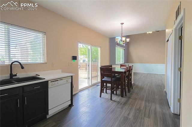 3808 Happy Jack Dr, Colorado Springs, CO 80922 - kitchen with white dishwasher, a sink, dark cabinets, and dark wood-style floors