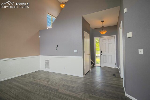 3808 Happy Jack Dr, Colorado Springs, CO 80922 - foyer entrance with dark wood finished floors and baseboards