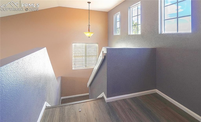 3808 Happy Jack Dr, Colorado Springs, CO 80922 - stairway with wood finished floors, lofted ceiling, and baseboards