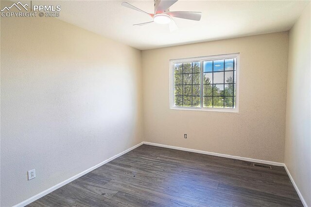 3808 Happy Jack Dr, Colorado Springs, CO 80922 - unfurnished room featuring baseboards, dark wood finished floors, and ceiling fan