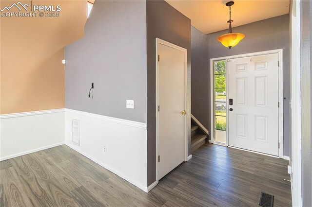 3808 Happy Jack Dr, Colorado Springs, CO 80922 - foyer featuring wood finished floors, baseboards, and stairs
