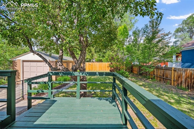 1428 N Prospect St, Colorado Springs, CO 80907 - wooden deck featuring a fenced backyard and an outbuilding