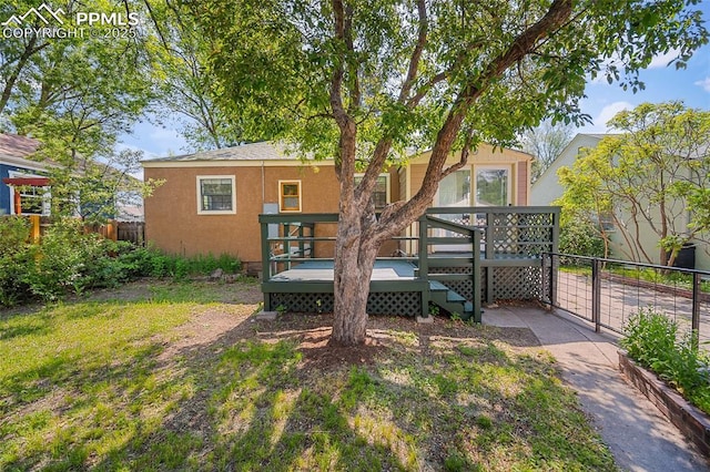 1428 N Prospect St, Colorado Springs, CO 80907 - rear view of property featuring a deck and stucco siding