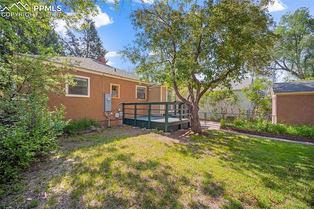 1428 N Prospect St, Colorado Springs, CO 80907 - rear view of property featuring a deck, stucco siding, and a chimney