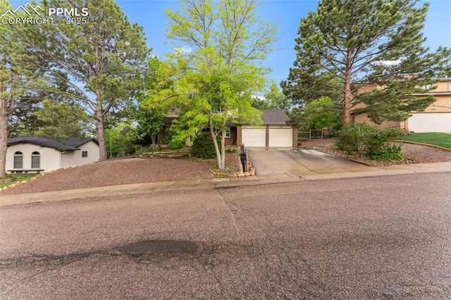 445 Wintery Cir, Colorado Springs, CO 80919 - view of front of property with concrete driveway and a garage