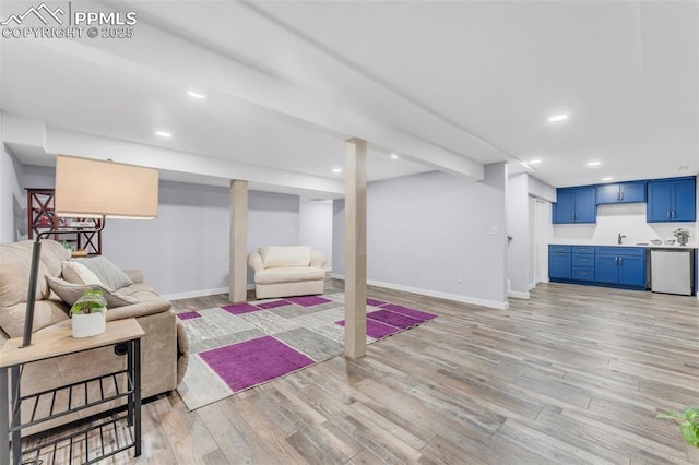 445 Wintery Cir, Colorado Springs, CO 80919 - living room with light wood-type flooring, baseboards, and recessed lighting