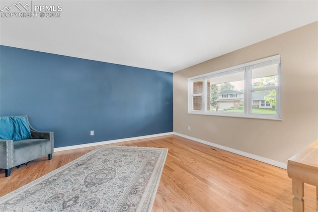 445 Wintery Cir, Colorado Springs, CO 80919 - living area with baseboards and wood finished floors