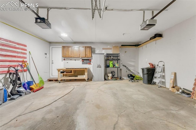445 Wintery Cir, Colorado Springs, CO 80919 - garage featuring a garage door opener