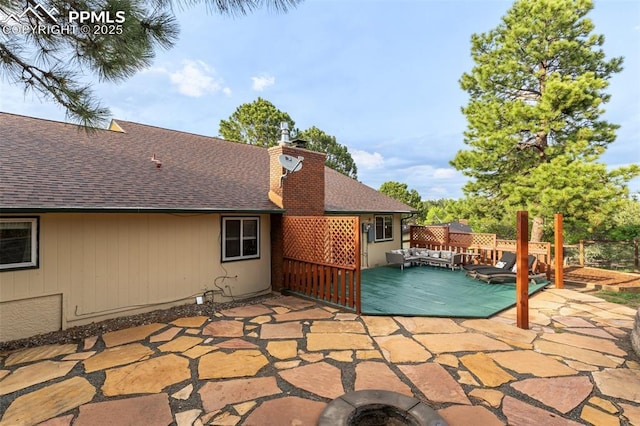 445 Wintery Cir, Colorado Springs, CO 80919 - view of swimming pool with a patio and an outdoor living space with a fire pit