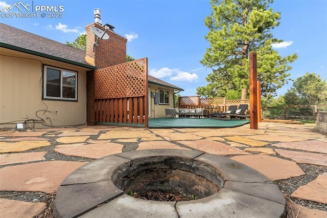 445 Wintery Cir, Colorado Springs, CO 80919 - view of patio / terrace with a fire pit and a deck
