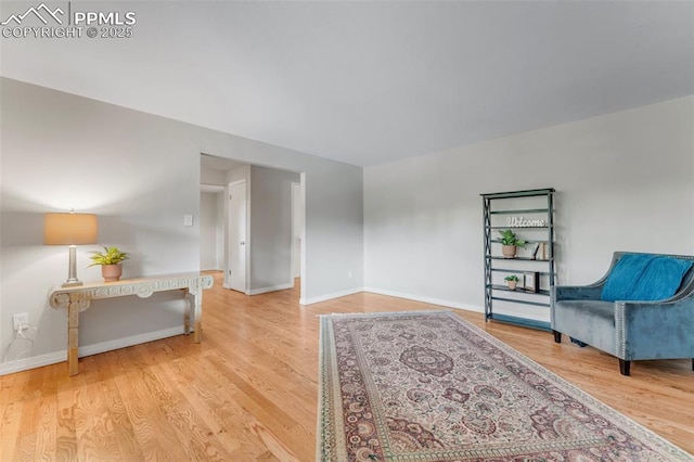 445 Wintery Cir, Colorado Springs, CO 80919 - living area featuring wood finished floors and baseboards