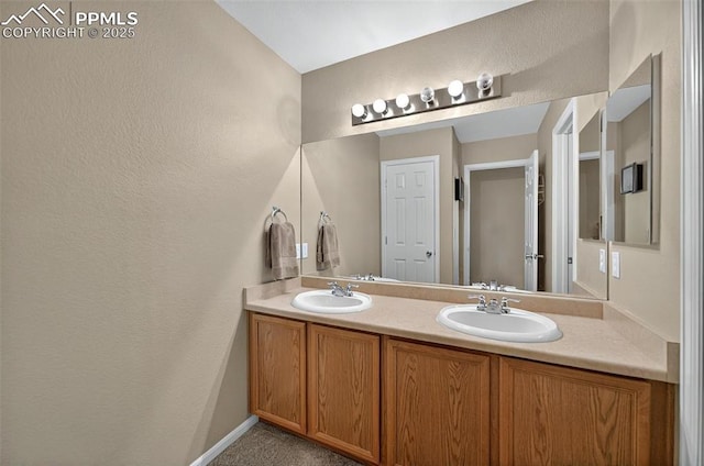 7470 Sandy Springs Pt, Fountain, CO 80817 - full bath featuring double vanity and a textured wall