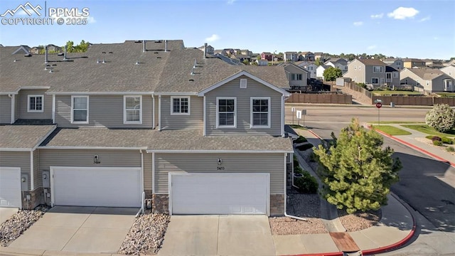 7470 Sandy Springs Pt, Fountain, CO 80817 - view of front of property with a residential view, a shingled roof, concrete driveway, and a garage