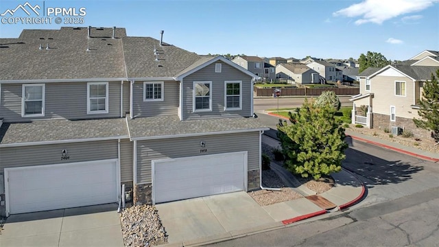 7470 Sandy Springs Pt, Fountain, CO 80817 - view of property featuring roof with shingles, a garage, a residential view, and concrete driveway