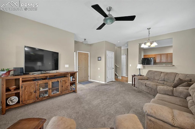 7470 Sandy Springs Pt, Fountain, CO 80817 - living area with carpet, a ceiling fan, baseboards, and a chandelier