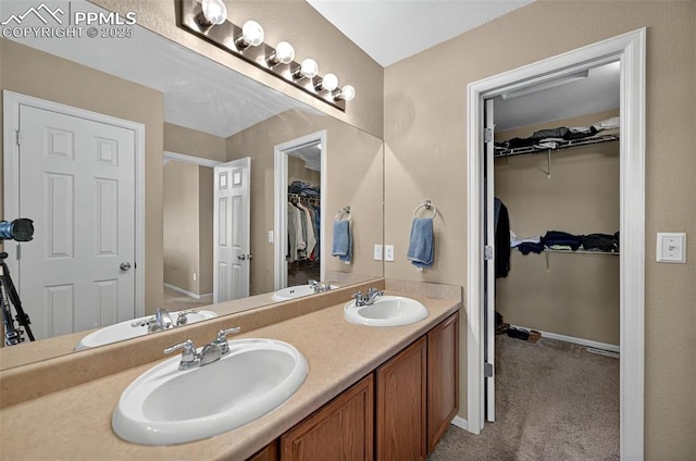 7470 Sandy Springs Pt, Fountain, CO 80817 - full bath with double vanity, baseboards, and a spacious closet