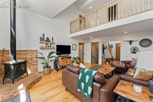 921 Cottonwood Lake Dr, Divide, CO 80814 - living room with a wood stove, a high ceiling, wood finished floors, and recessed lighting