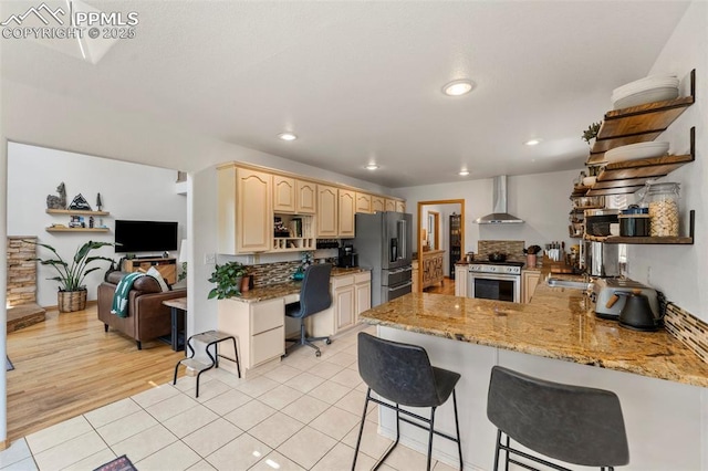 921 Cottonwood Lake Dr, Divide, CO 80814 - kitchen featuring stainless steel appliances, wall chimney exhaust hood, open shelves, a peninsula, and recessed lighting