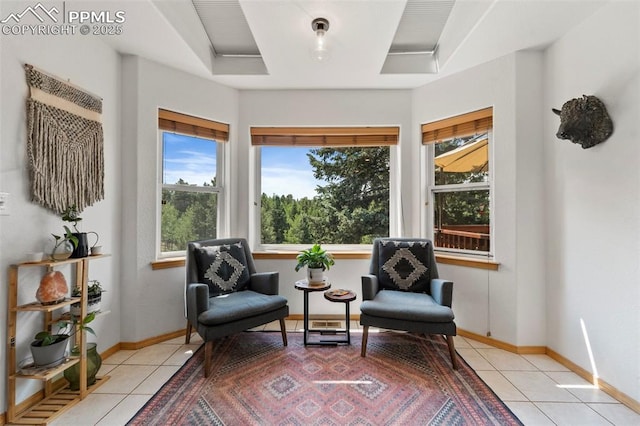 921 Cottonwood Lake Dr, Divide, CO 80814 - sitting room with light tile patterned flooring, a tray ceiling, and baseboards