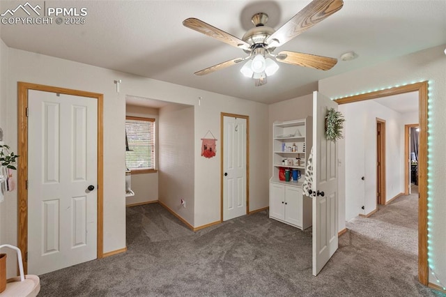 921 Cottonwood Lake Dr, Divide, CO 80814 - unfurnished bedroom featuring carpet flooring, baseboards, and ceiling fan