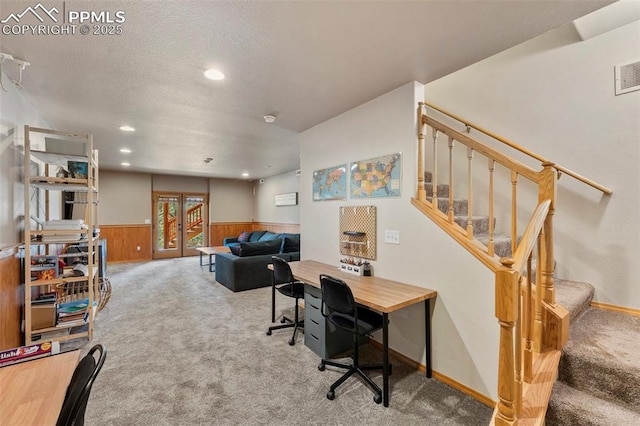 921 Cottonwood Lake Dr, Divide, CO 80814 - carpeted home office with french doors, a wainscoted wall, recessed lighting, wood walls, and a textured ceiling