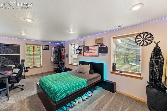 921 Cottonwood Lake Dr, Divide, CO 80814 - bedroom featuring carpet, baseboards, multiple windows, and recessed lighting