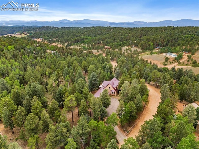 921 Cottonwood Lake Dr, Divide, CO 80814 - bird's eye view of a heavily wooded area and mountains