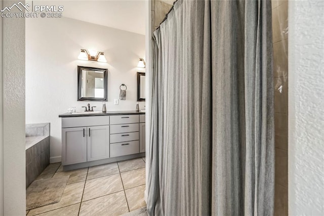 bathroom with vanity, tile patterned flooring, a tub, and a shower with shower curtain