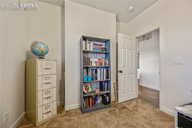 carpeted bedroom featuring baseboards