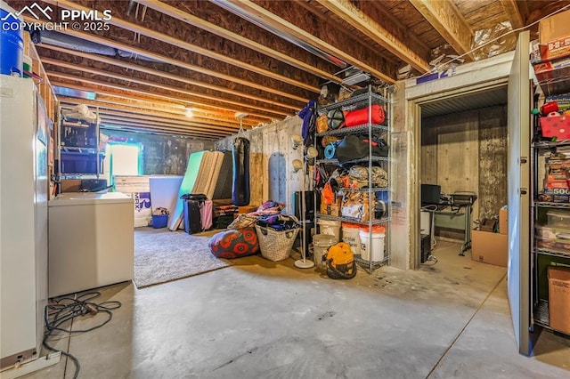 below grade area featuring washing machine and dryer