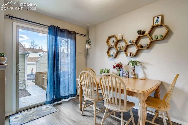 7911 Lexington Park Dr, Colorado Springs, CO 80920 - dining room with wood finished floors and baseboards
