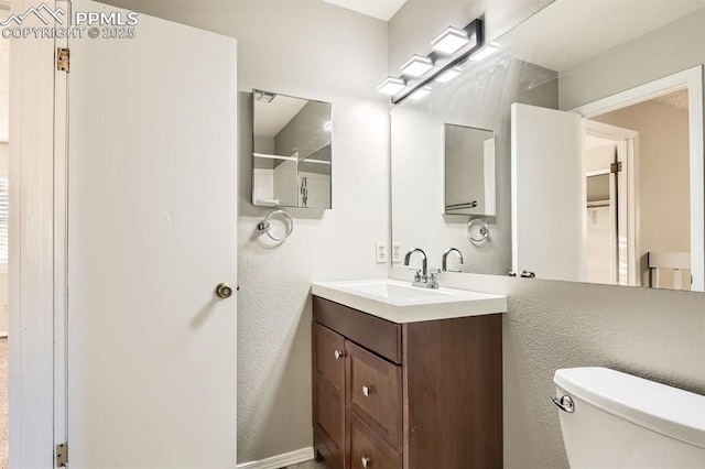 7911 Lexington Park Dr, Colorado Springs, CO 80920 - bathroom featuring toilet and vanity