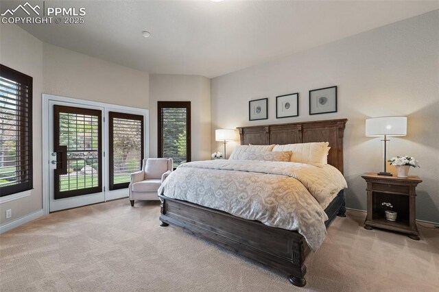 10061 Oak Knoll Ter, Colorado Springs, CO 80920 - bedroom featuring light colored carpet, access to outside, and baseboards