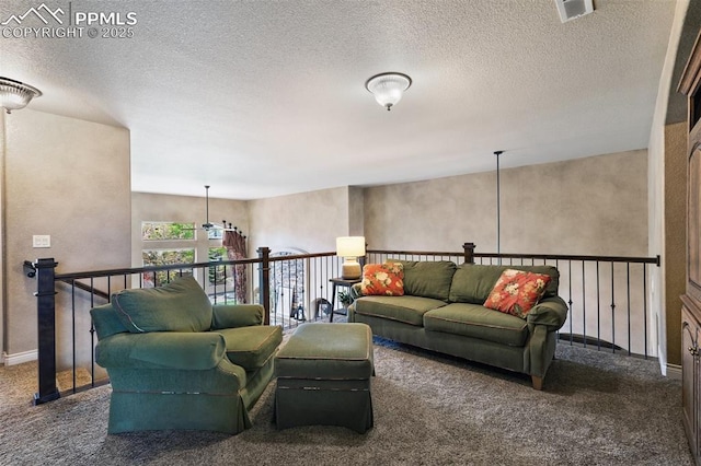 10061 Oak Knoll Ter, Colorado Springs, CO 80920 - carpeted living room featuring a textured ceiling