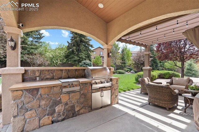 10061 Oak Knoll Ter, Colorado Springs, CO 80920 - view of patio / terrace with an outdoor kitchen, grilling area, and an outdoor hangout area