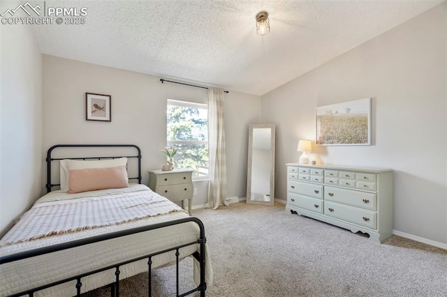 bedroom with a textured ceiling, light carpet, lofted ceiling, and baseboards