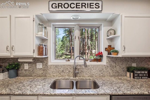 18045 Woodhaven Pl, Colorado Springs, CO 80908 - kitchen with a sink, open shelves, dishwashing machine, white cabinets, and backsplash