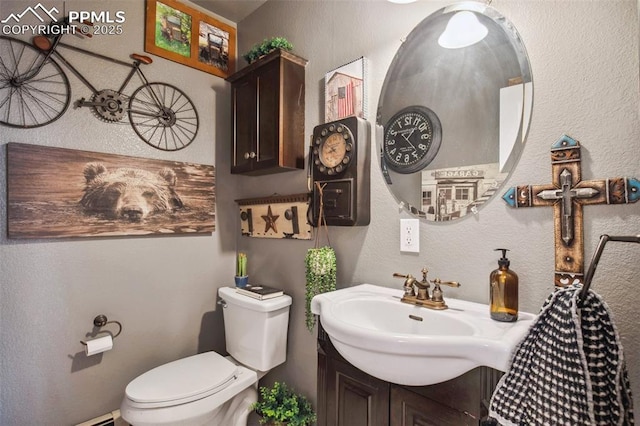 18045 Woodhaven Pl, Colorado Springs, CO 80908 - half bath with toilet, vanity, and a textured wall