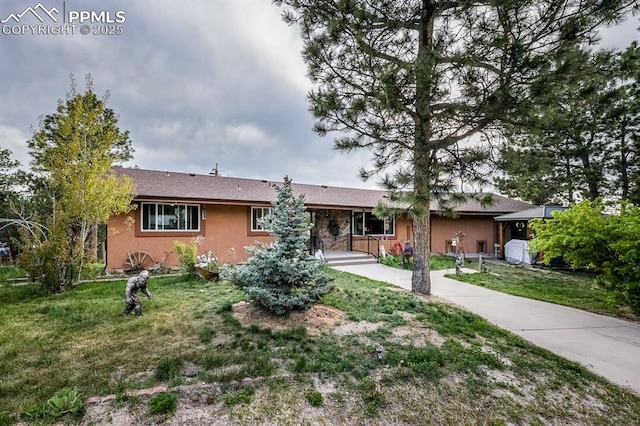 2760 Evergreen Rd, Colorado Springs, CO 80921 - single story home with a front yard and stucco siding