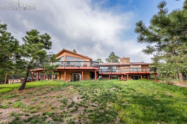 2760 Evergreen Rd, Colorado Springs, CO 80921 - rear view of property with a wooden deck and a chimney
