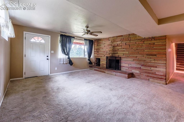 2760 Evergreen Rd, Colorado Springs, CO 80921 - unfurnished living room featuring a ceiling fan, a fireplace, carpet, and baseboards