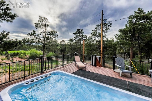 2760 Evergreen Rd, Colorado Springs, CO 80921 - view of swimming pool with a wooden deck and an outdoor hot tub