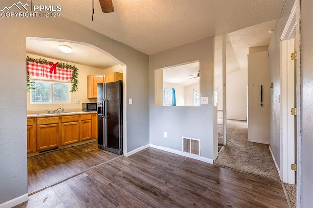2760 Evergreen Rd, Colorado Springs, CO 80921 - kitchen featuring black appliances, ceiling fan, dark wood-style floors, and a textured ceiling