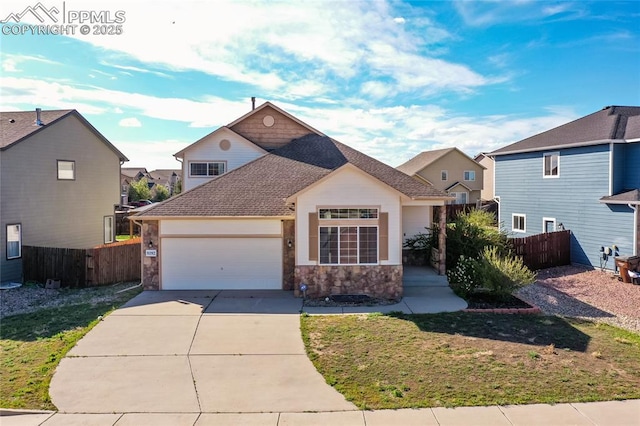 traditional-style house featuring stone siding, an attached garage, driveway, a residential view, and a shingled roof