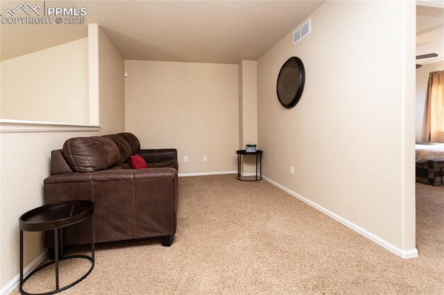 living area with carpet floors and baseboards