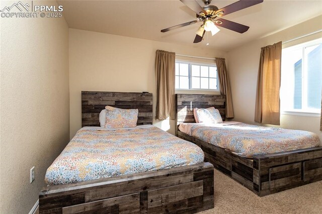 bedroom with carpet and a ceiling fan